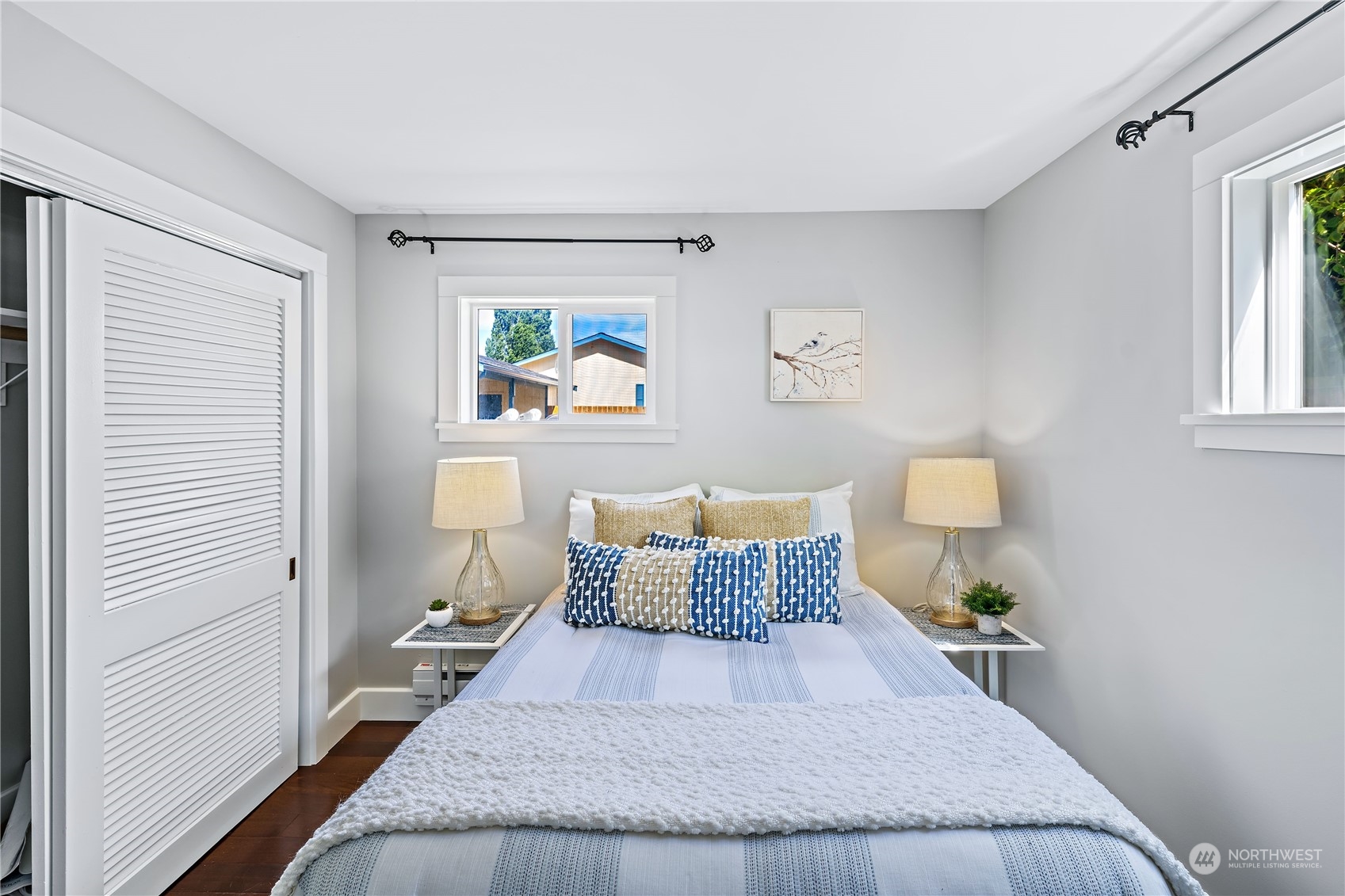 9012 7th Avenue Northwest Seattle, WA 98117 - Photo 27 of 36 a bedroom with a bed and painting on the wall