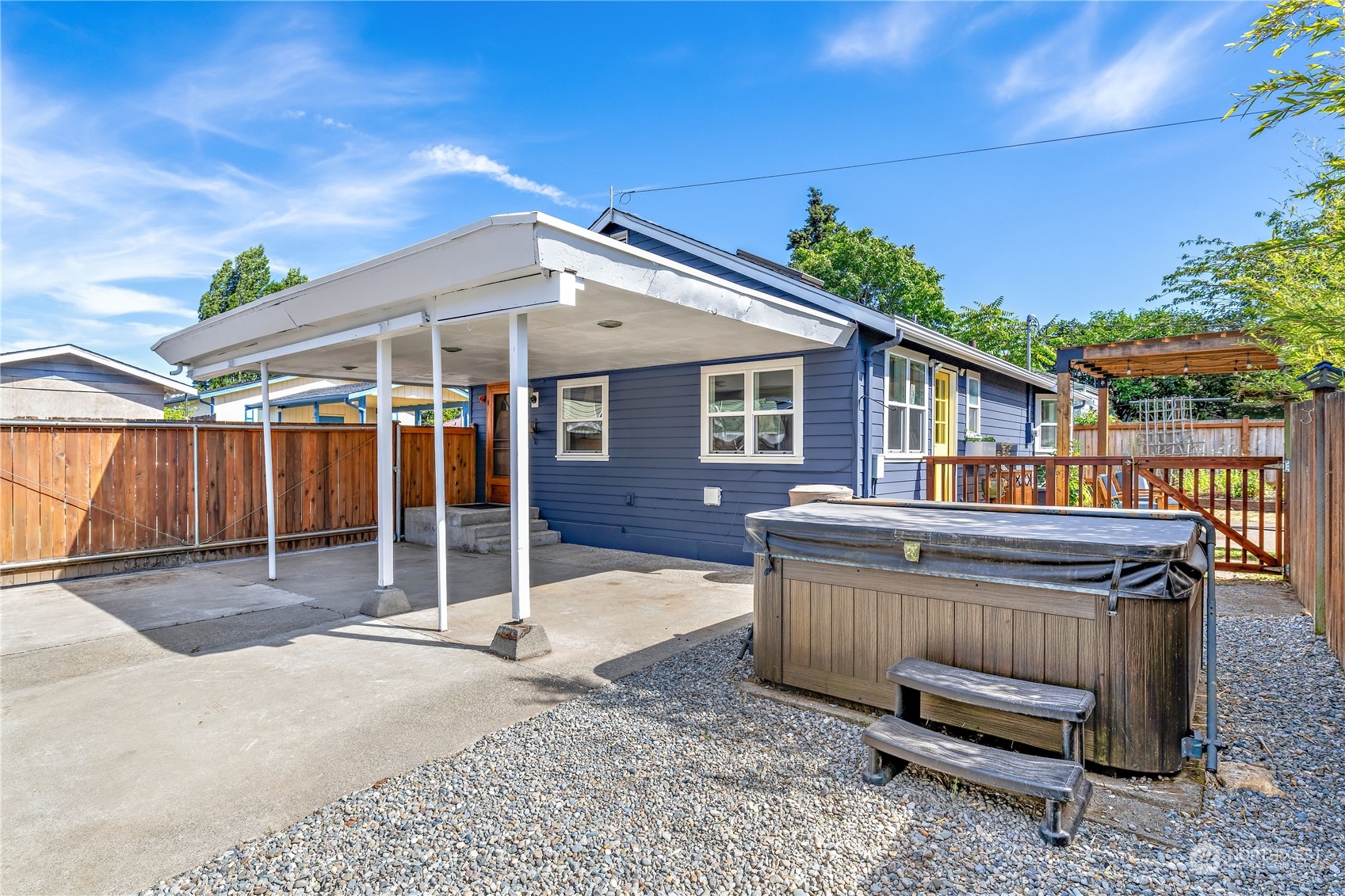 9012 7th Avenue Northwest Seattle, WA 98117 - Photo 28 of 36 a view of a house with a yard and wooden fence