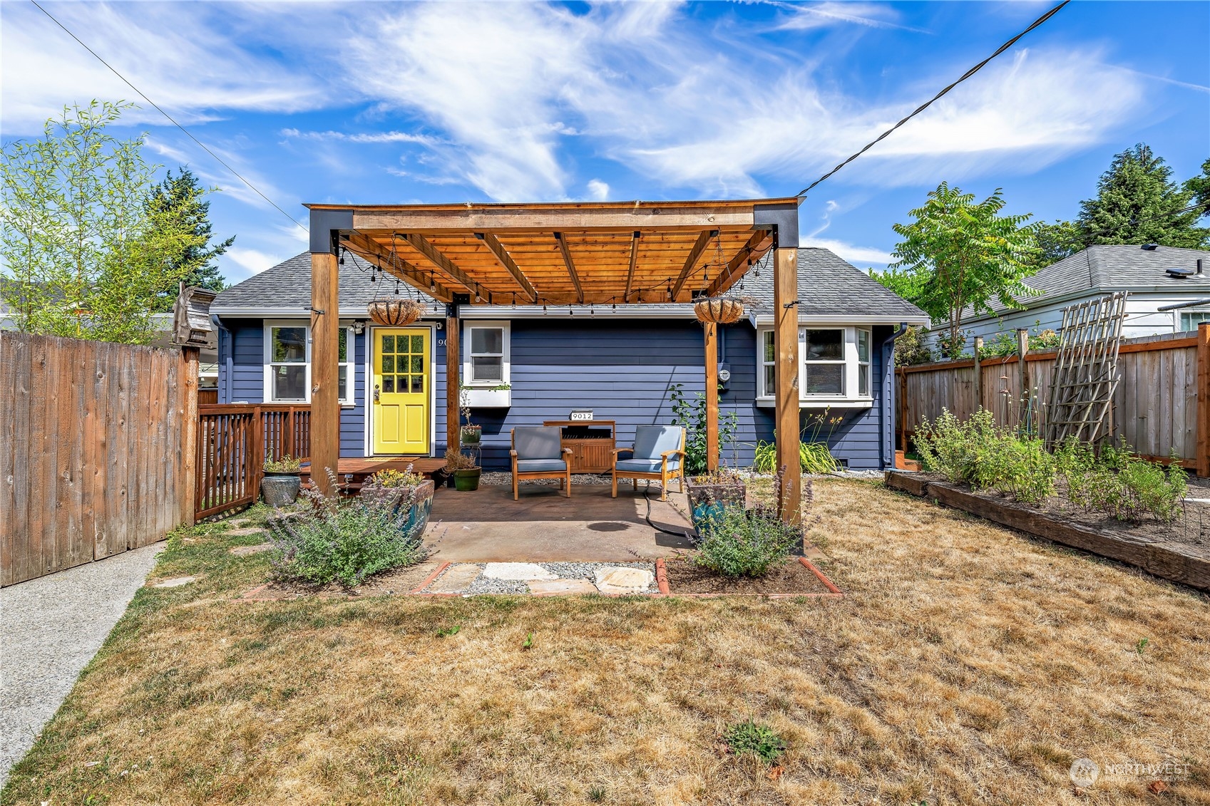 9012 7th Avenue Northwest Seattle, WA 98117 - Photo 3 of 36 a view of a house with backyard and sitting area
