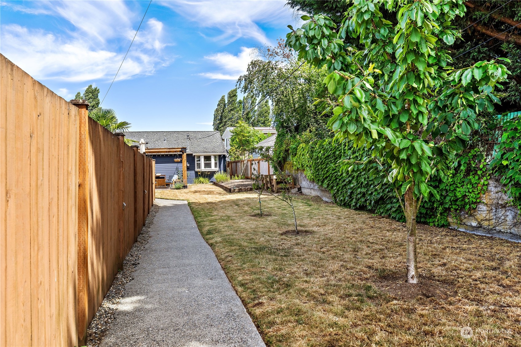 9012 7th Avenue Northwest Seattle, WA 98117 - Photo 32 of 36 a view of a backyard with patio