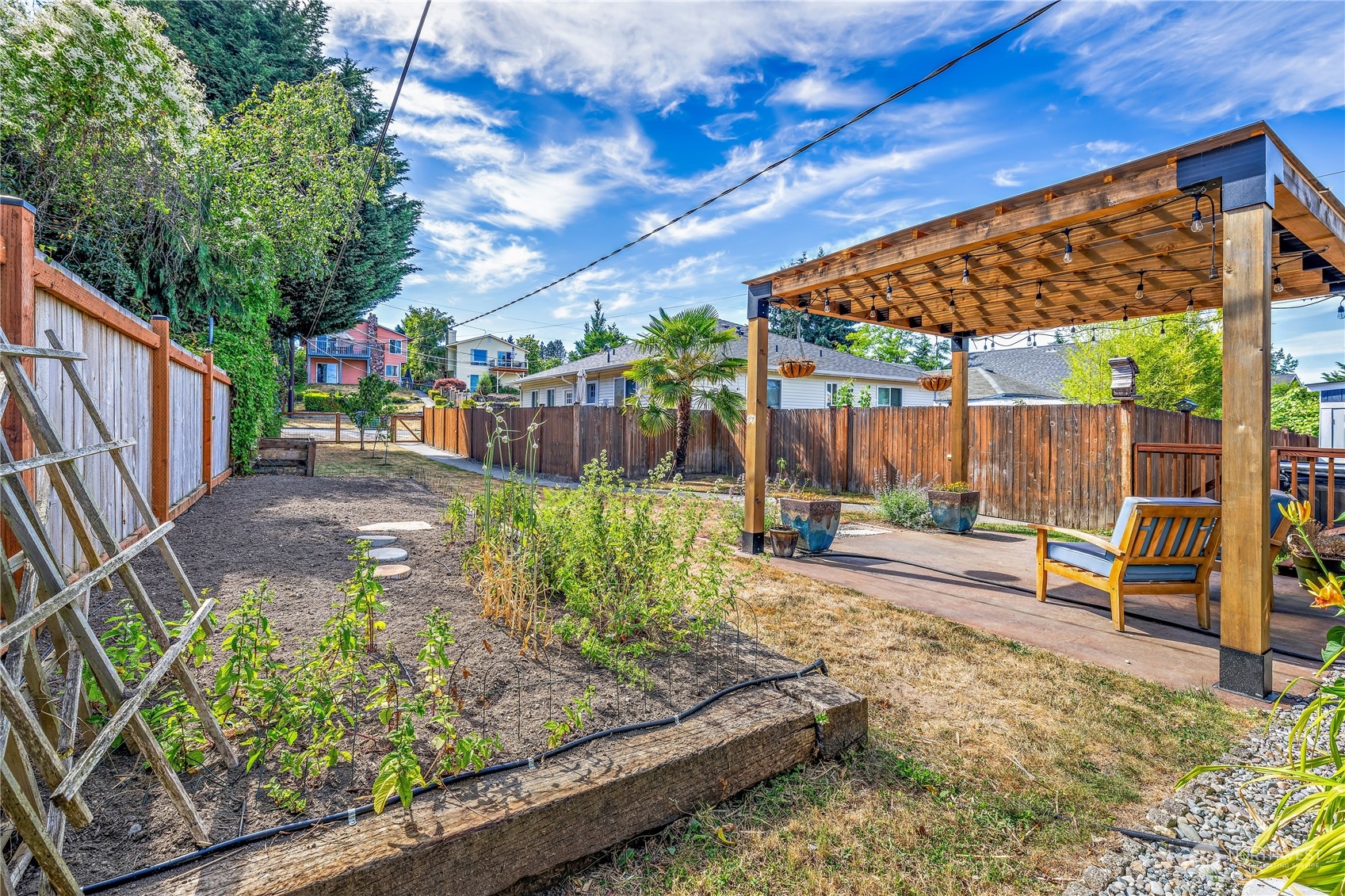 9012 7th Avenue Northwest Seattle, WA 98117 - Photo 34 of 36 a view of a backyard with sitting area and furniture