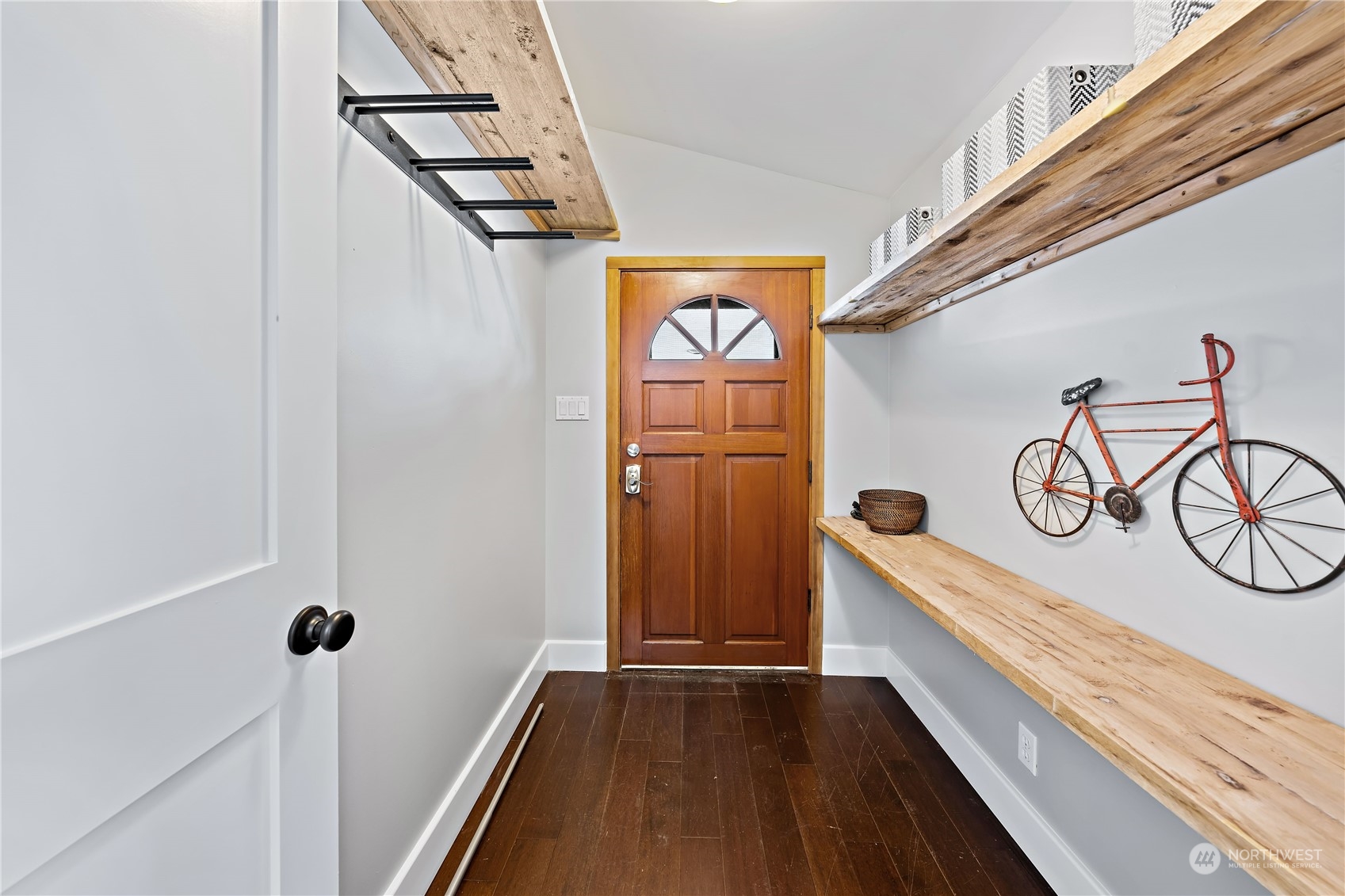 9012 7th Avenue Northwest Seattle, WA 98117 - Photo 7 of 36 a view of a hallway with stairs
