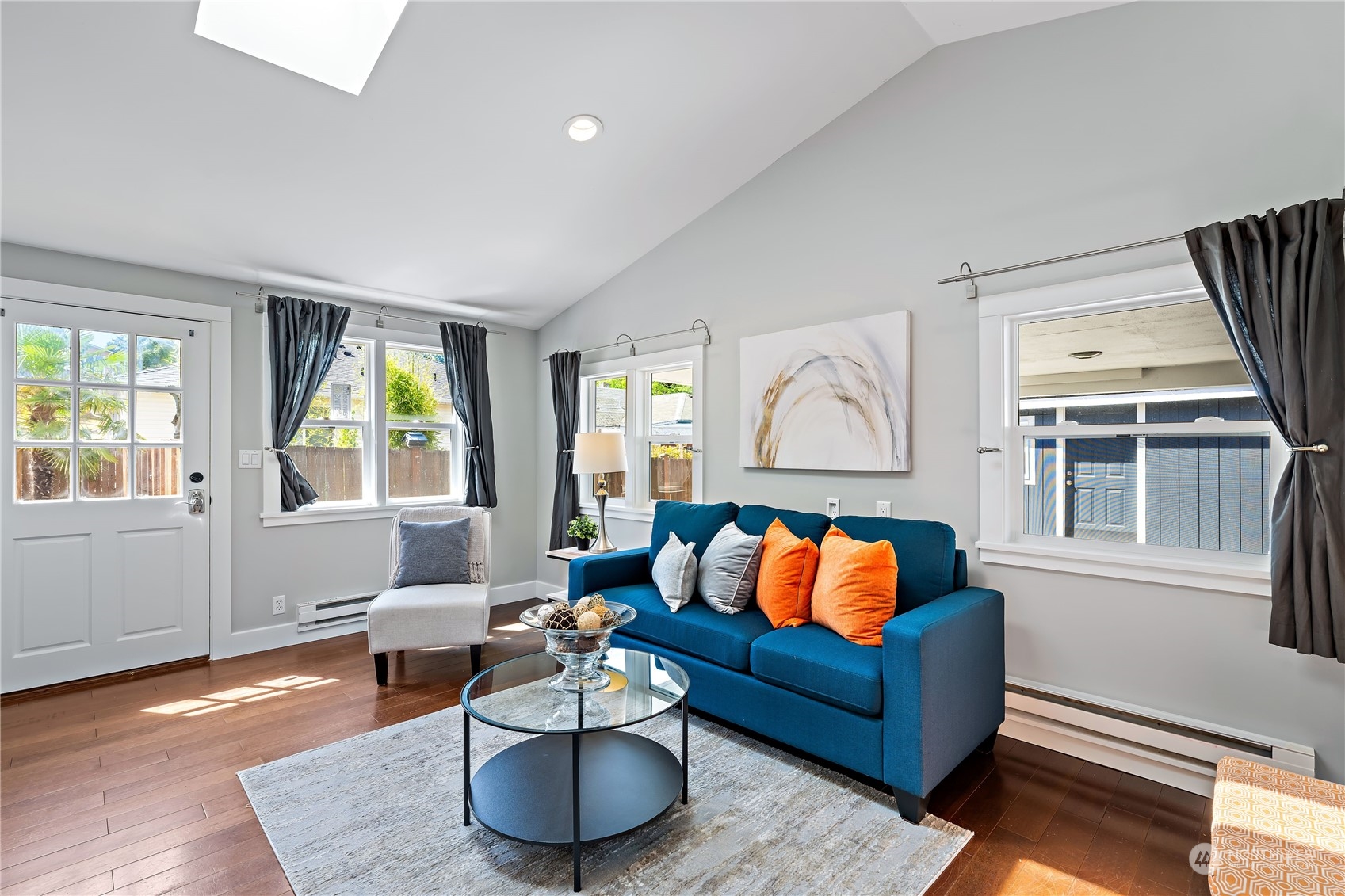 9012 7th Avenue Northwest Seattle, WA 98117 - Photo 9 of 36 a living room with furniture and a window