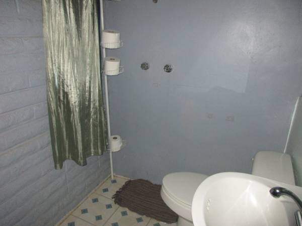 5791 Reno Lane Redding, CA 96001 - Photo 6 of 20 a bathroom with a toilet and a shower