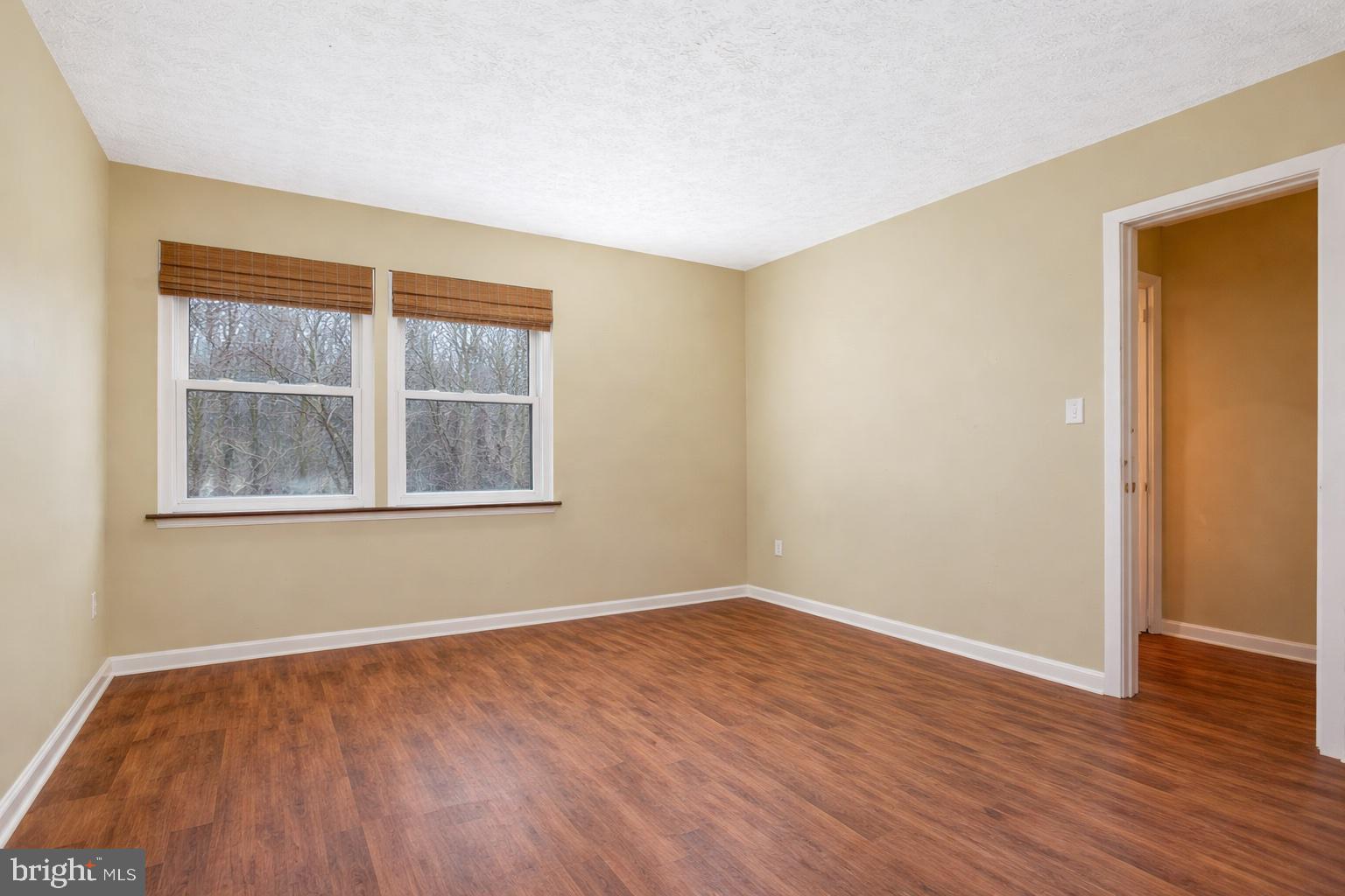7579 Weather Worn Way, Unit D Columbia, MD 21046 - Photo 13 of 24 a view of empty room with wooden floor and fan