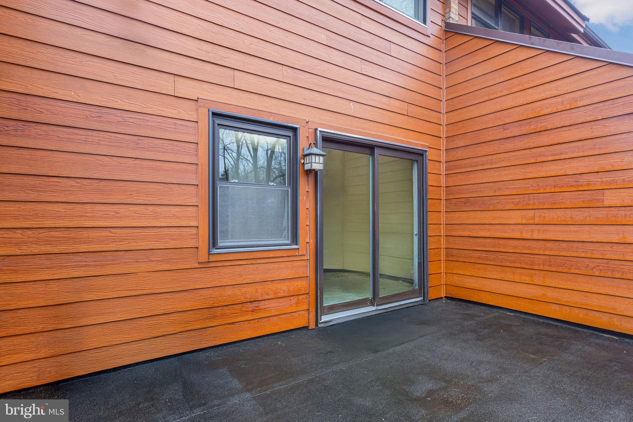 7579 Weather Worn Way, Unit D Columbia, MD 21046 - Photo 15 of 24 a front view of a house with a garage
