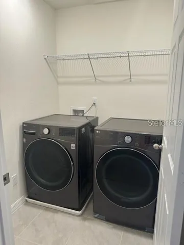 a utility room with dryer and washer