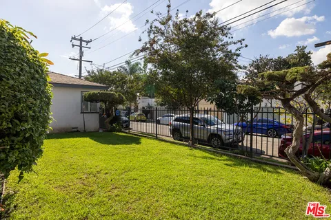 a view of a swimming pool with a patio and yard