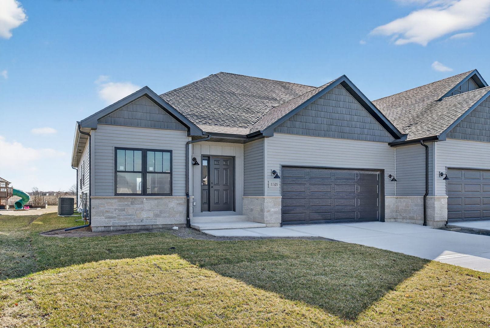 front view of a house with a yard