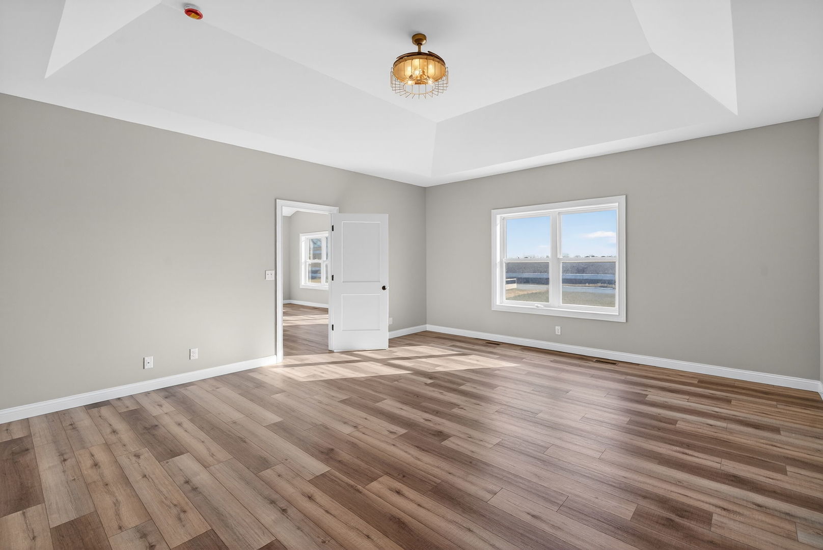 1165 Farmstone Drive Diamond, IL 60416 - Photo 12 of 35 a view of an empty room with window and wooden floor