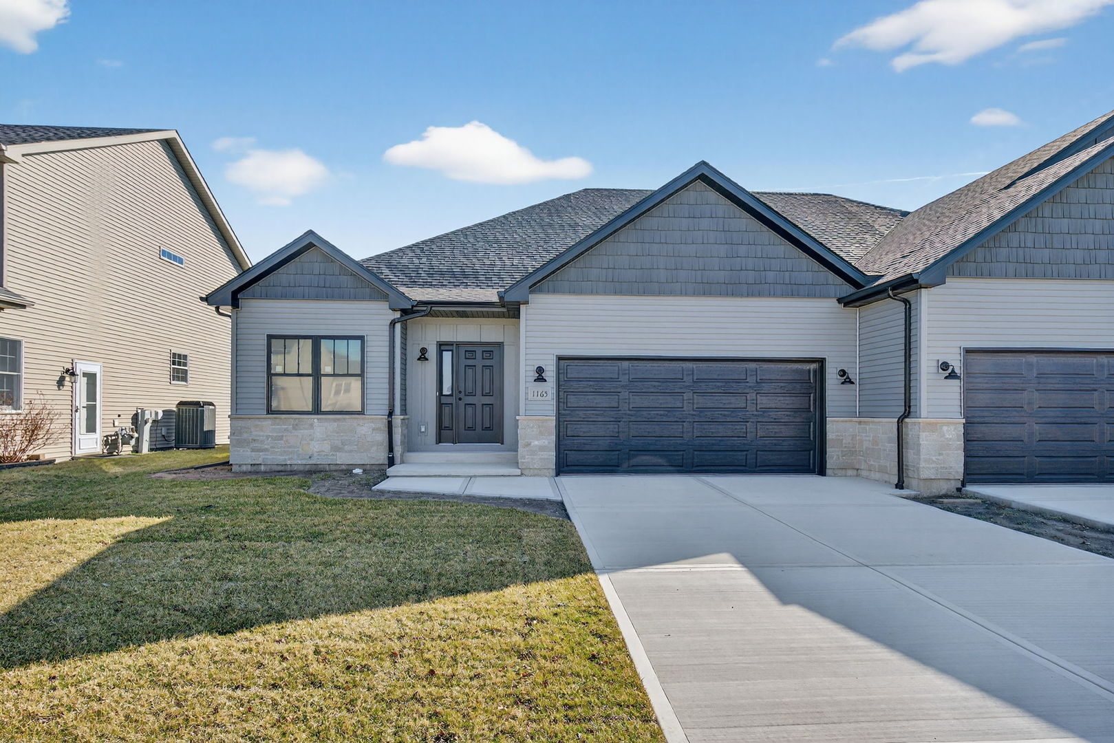 1165 Farmstone Drive Diamond, IL 60416 - Photo 2 of 35 a front view of a house with a yard and garage