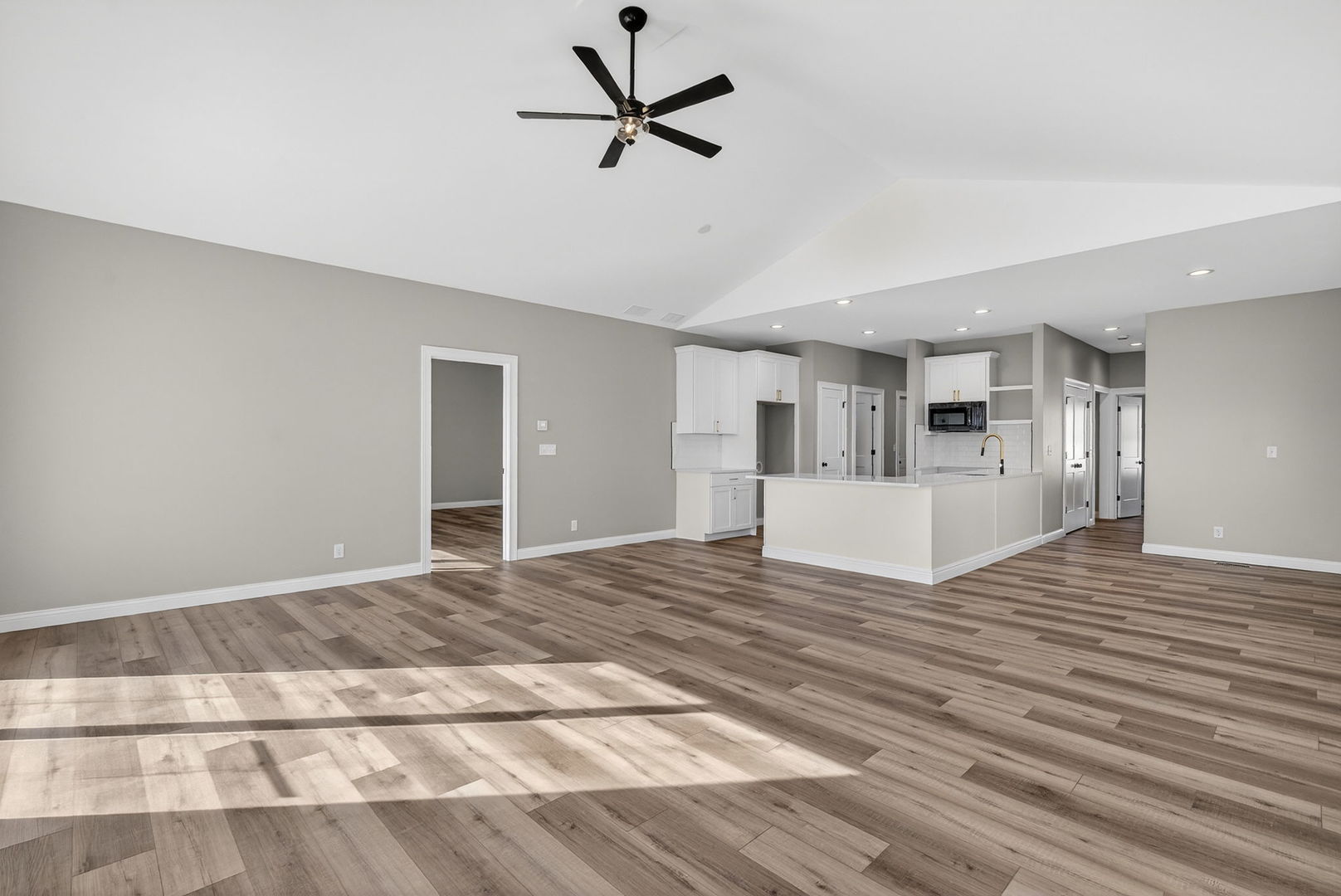 1165 Farmstone Drive Diamond, IL 60416 - Photo 24 of 35 a view of empty room with wooden floor and ceiling fan