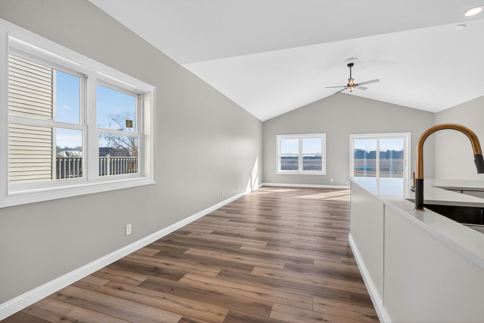 1165 Farmstone Drive Diamond, IL 60416 - Photo 27 of 35 a view of empty room with wooden floor and fan