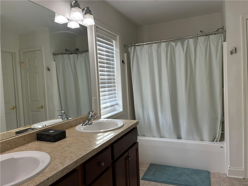 18 Dona Lea Road Perinton, NY 14450 - Photo 17 of 29 Primary Bathroom is spacious and flows into a walk-in closet.