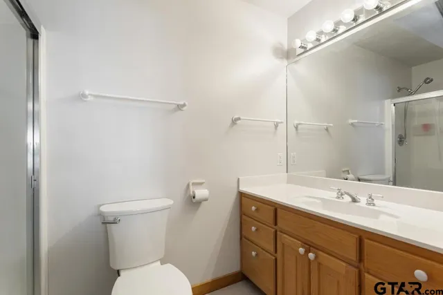 a bathroom with a toilet a sink and bathtub