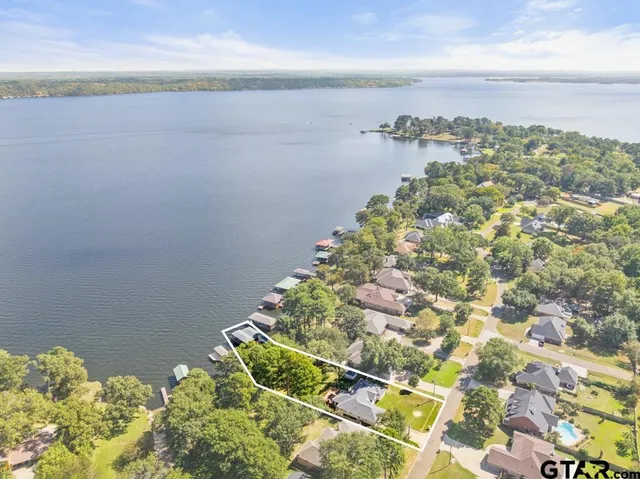 a view of a patio with a table and chairs