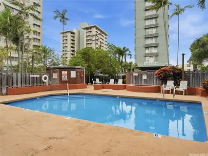 a view of a swimming pool with a lounge chairs