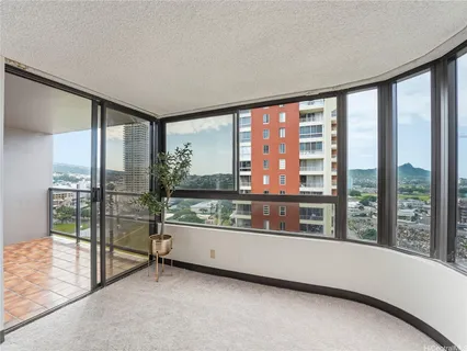 a view of an empty room and balcony