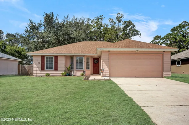 front view of a house with a garden