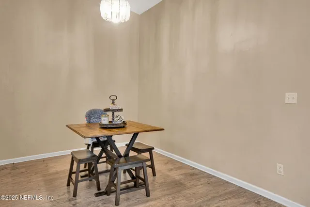 a view of a workspace with furniture and window