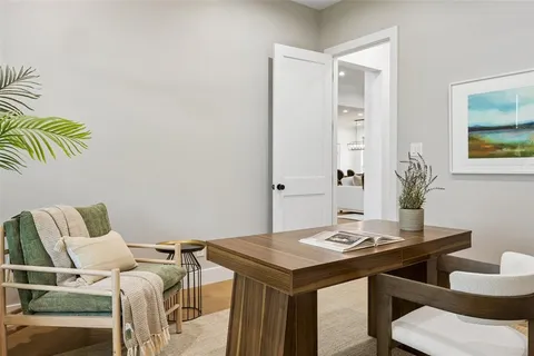 a view of a room that has a couch and a table in it