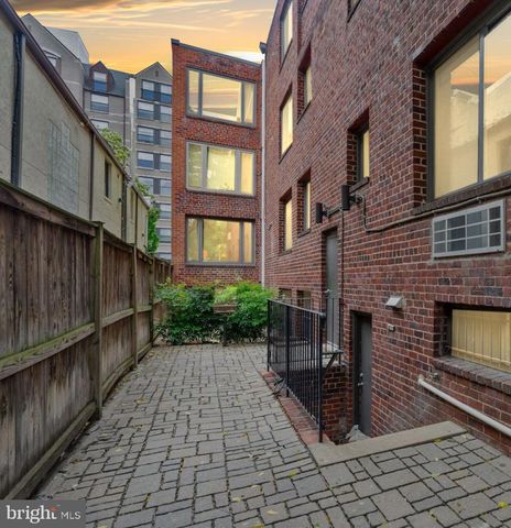 a view of a brick building with many windows