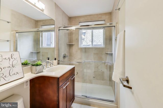 a bathroom with a sink mirror toilet and bathtub
