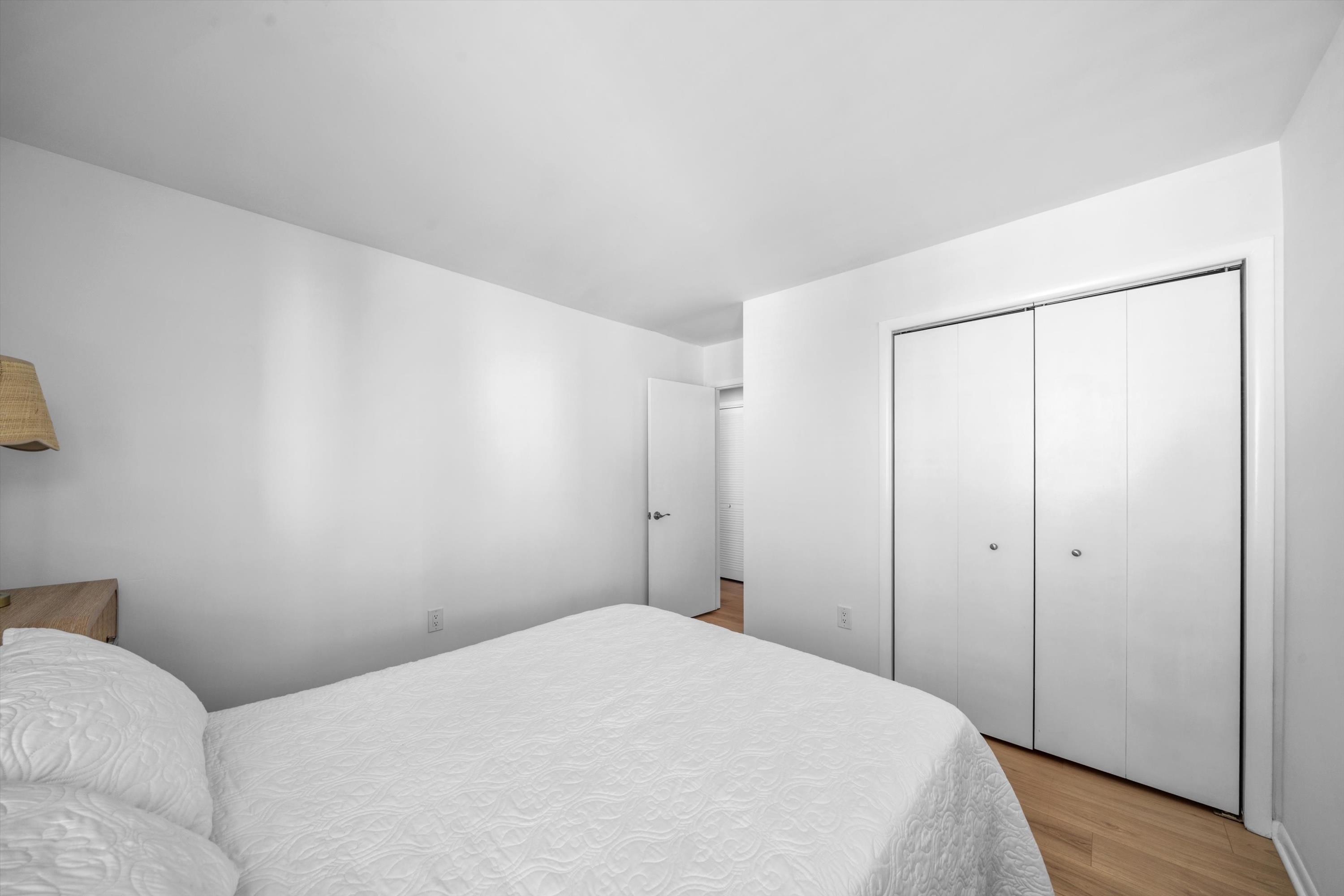 127 40th Street, Unit 1F Sea Isle City, NJ 08243 - Photo 25 of 28 a bedroom with a bed and a closet