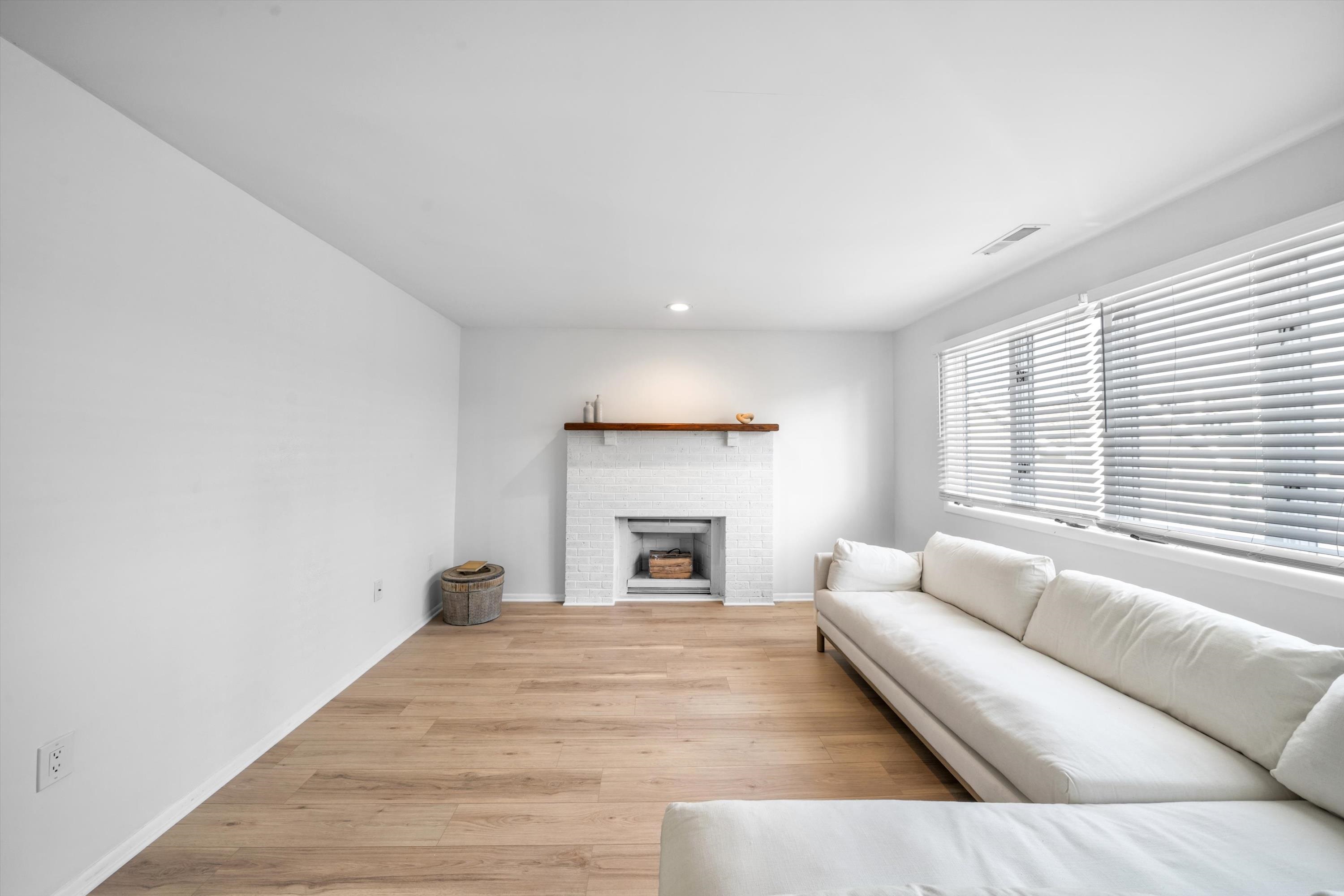 127 40th Street, Unit 1F Sea Isle City, NJ 08243 - Photo 6 of 28 a living room with furniture and a fireplace