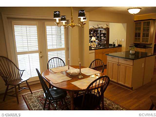 2350 Winterfield Road Midlothian, VA 23113 - Photo 5 of 13 a view of a dining room with furniture and chandelier