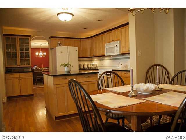 2350 Winterfield Road Midlothian, VA 23113 - Photo 6 of 13 a view of a dining room with furniture and wooden floor