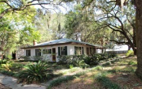 96283 Freeman Road Yulee, FL 32097 - Photo 1 of 17 a front view of house with yard and green space