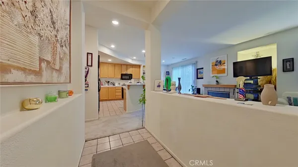 a view of living room kitchen with furniture and a flat screen tv