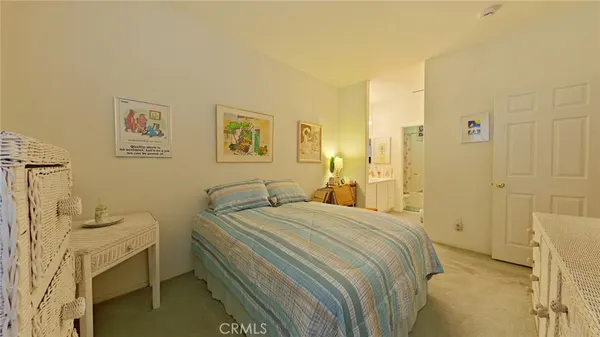 a bedroom with a bed and a cabinets