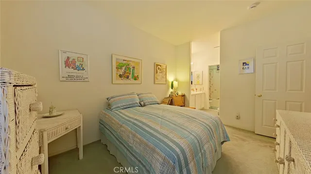 a bedroom with a bed and a cabinets