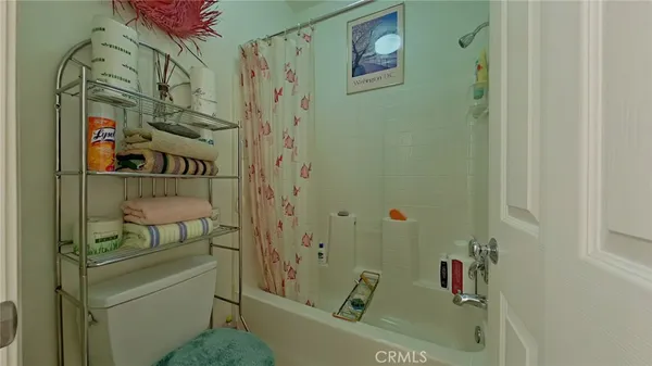 a bathroom with a bathtub and shower