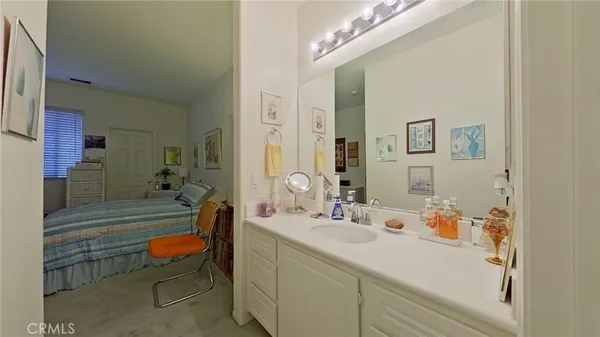 a bathroom with a sink mirror and a bathtub