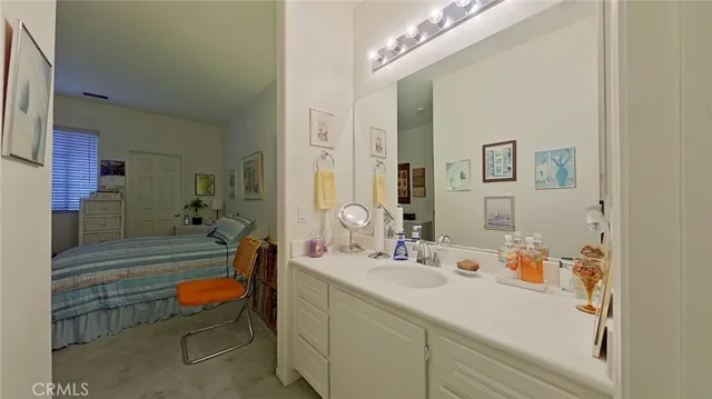 a bathroom with a sink mirror and a bathtub