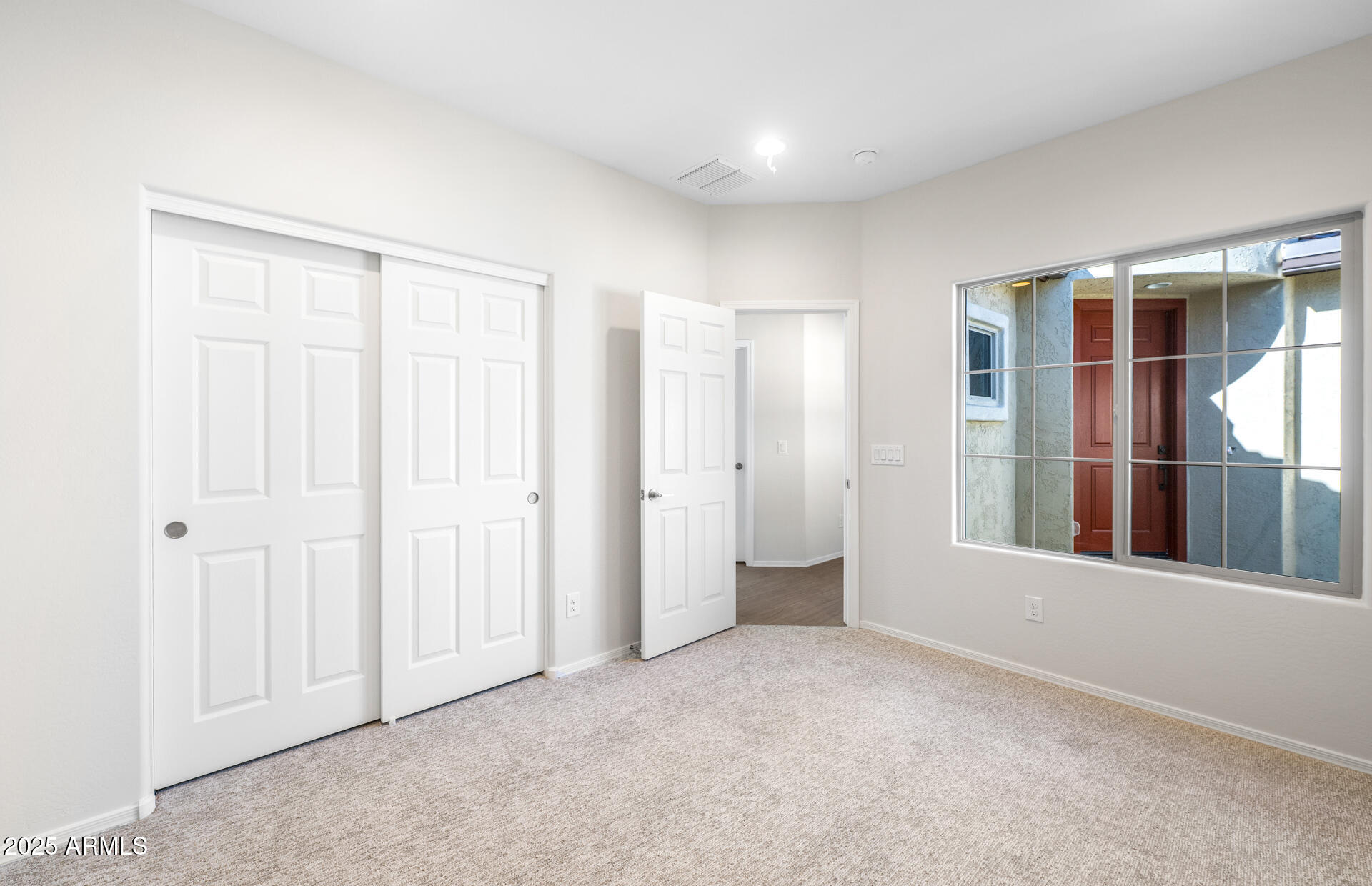 6826 West Ripken Way Florence, AZ 85132 - Photo 11 of 35 an empty room with windows