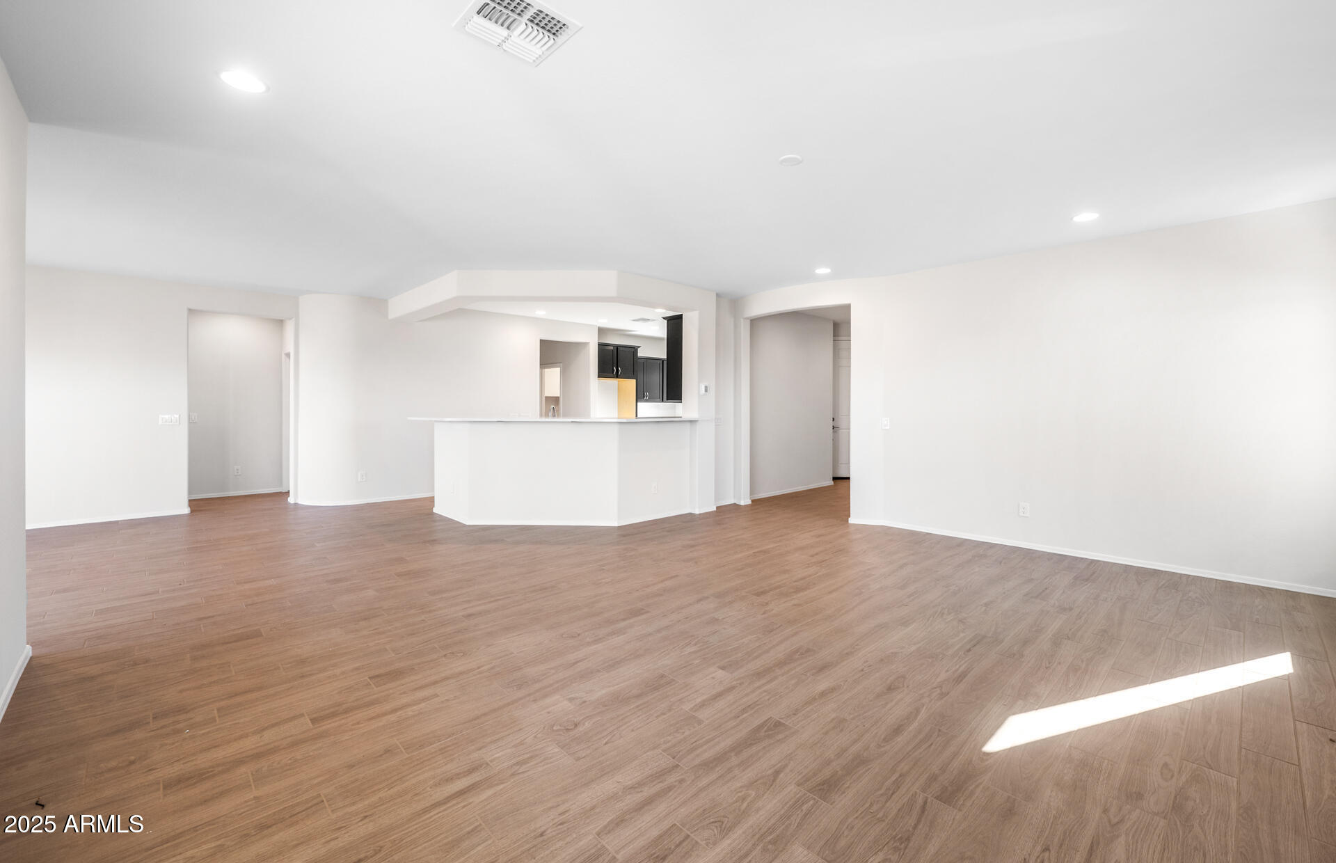 6826 West Ripken Way Florence, AZ 85132 - Photo 17 of 35 a view of a kitchen with wooden floor and a kitchen