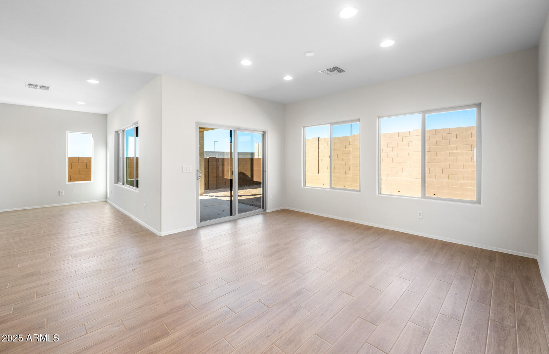 6826 West Ripken Way Florence, AZ 85132 - Photo 18 of 35 a view of a livingroom with wooden floor and windows