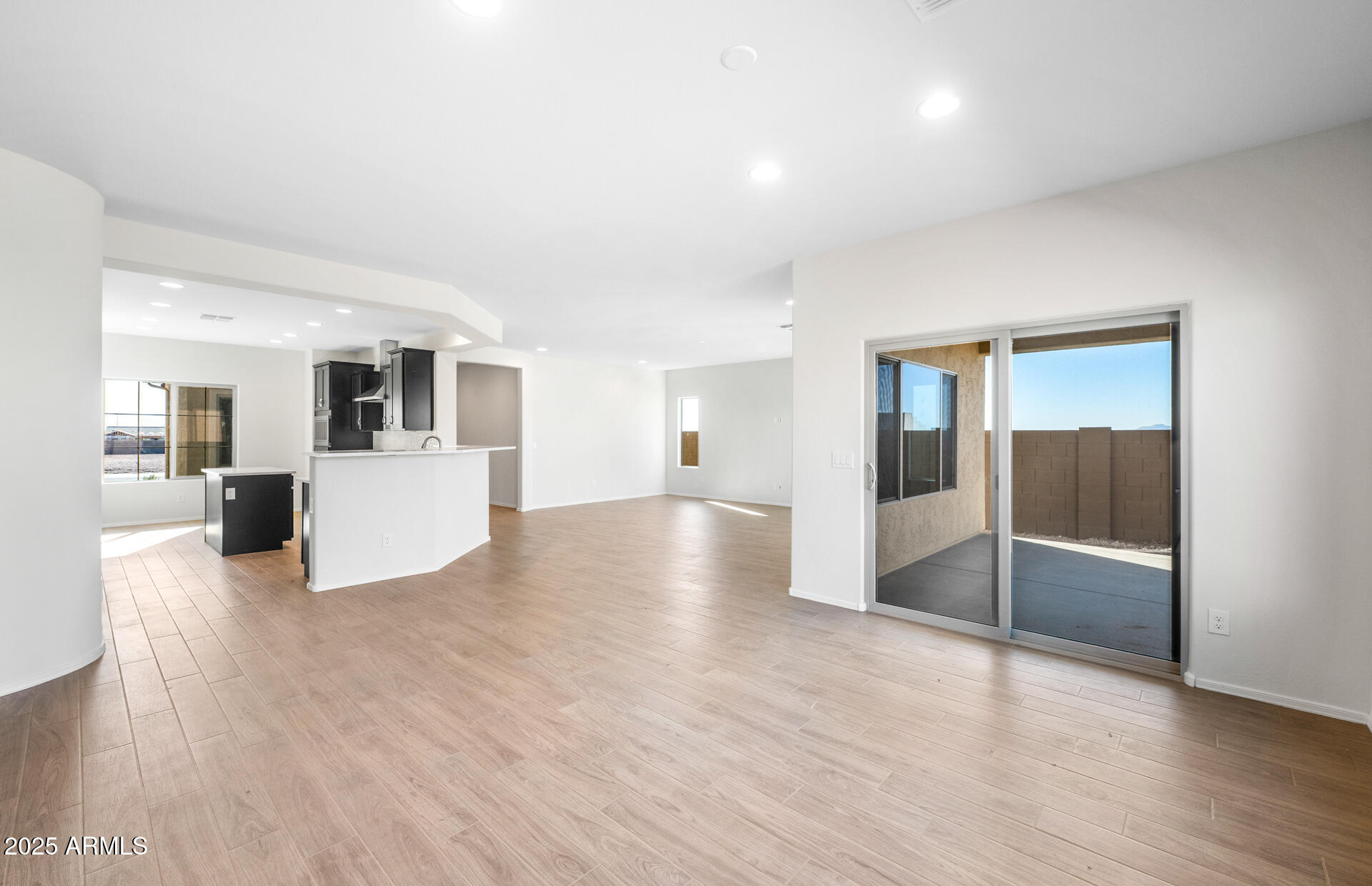 6826 West Ripken Way Florence, AZ 85132 - Photo 19 of 35 a view of a kitchen with furniture and wooden floor