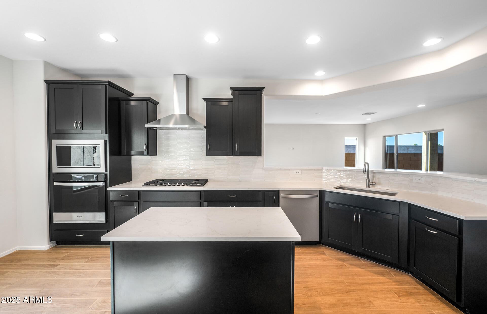 6826 West Ripken Way Florence, AZ 85132 - Photo 22 of 35 a kitchen with stainless steel appliances granite countertop a sink counter space cabinets and stainless steel appliances