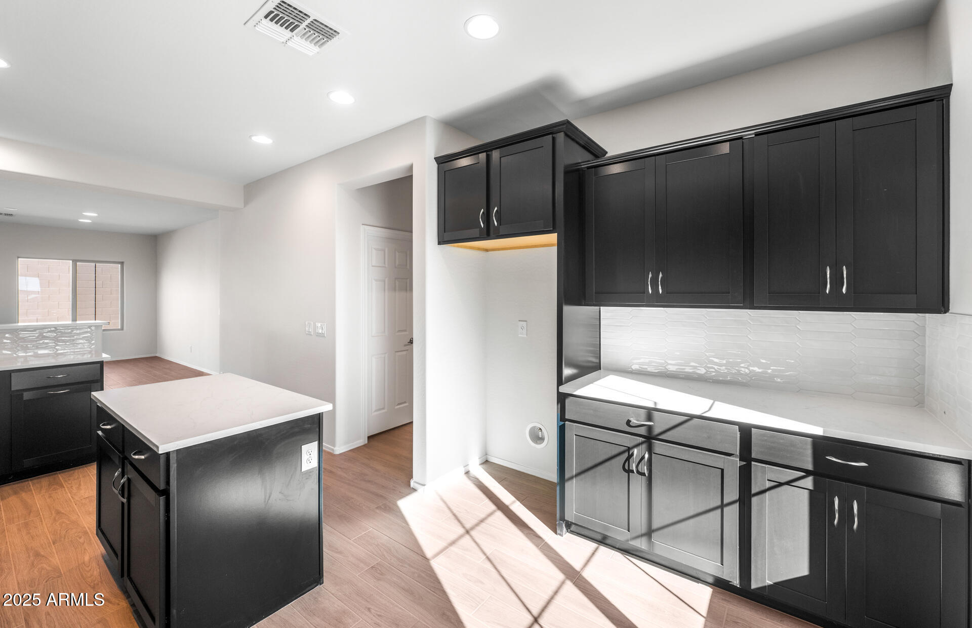 6826 West Ripken Way Florence, AZ 85132 - Photo 25 of 35 a kitchen with stainless steel appliances granite countertop a sink and a refrigerator