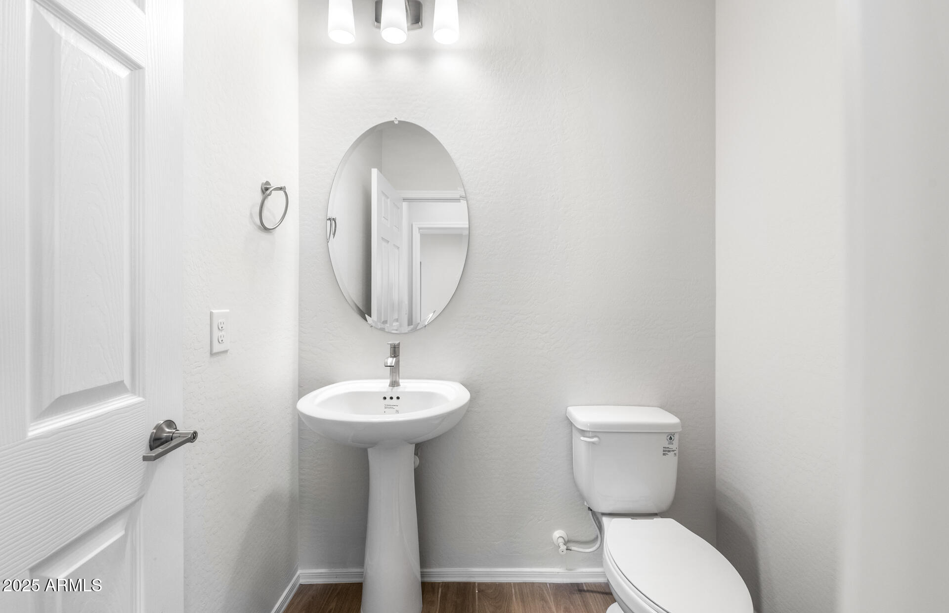 6826 West Ripken Way Florence, AZ 85132 - Photo 27 of 35 a bathroom with a toilet sink and mirror