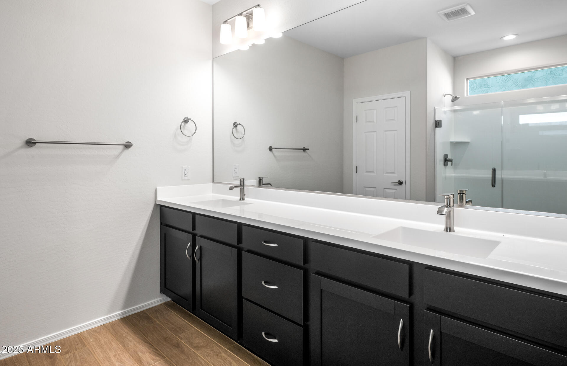 6826 West Ripken Way Florence, AZ 85132 - Photo 33 of 35 a bathroom with a double vanity sink and mirror