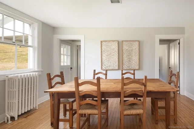 a view of a dining room with furniture and window