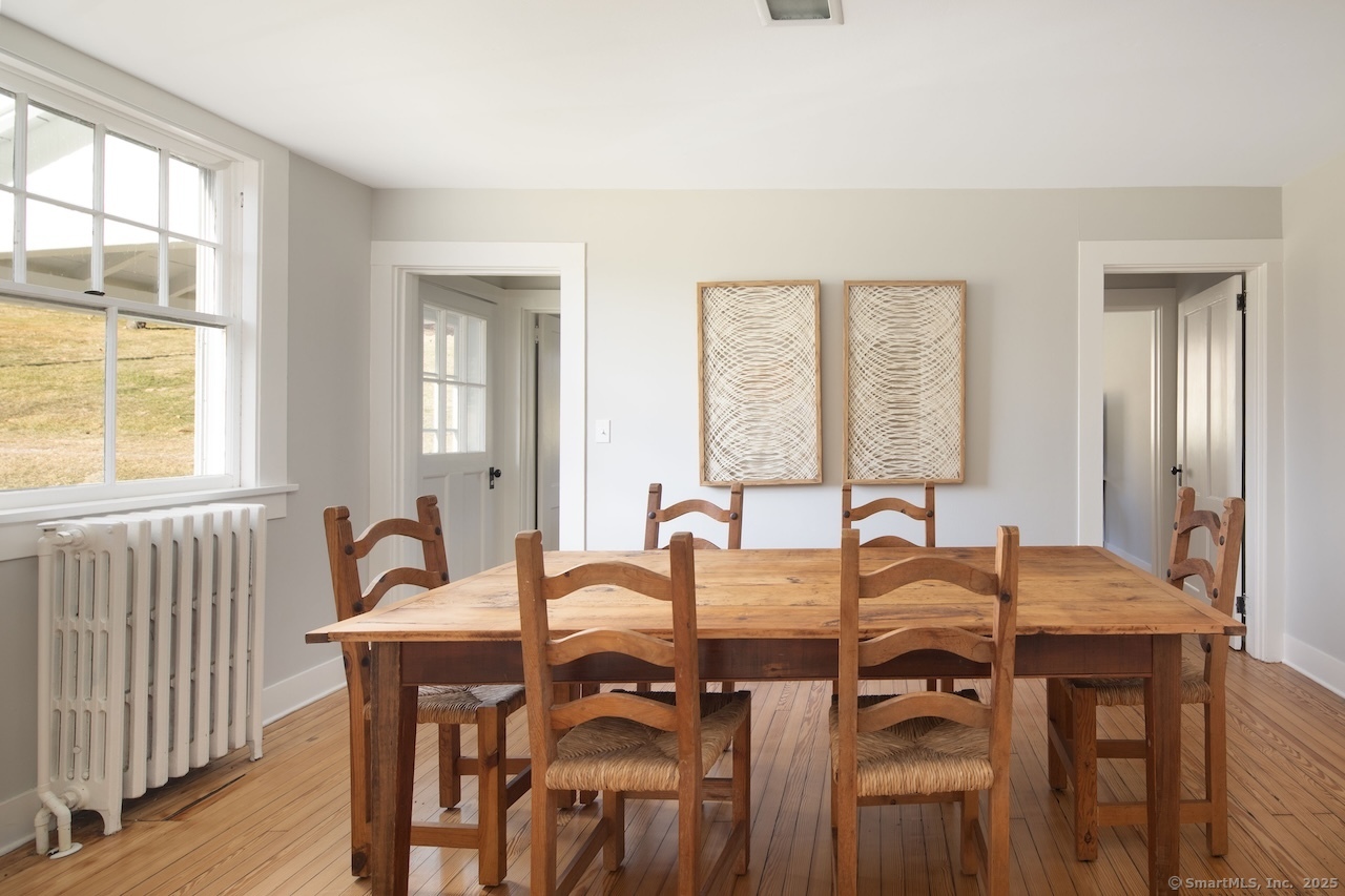 104 Sunset Ridge Road Norfolk, CT 06058 - Photo 7 of 20 a view of a dining room with furniture and window