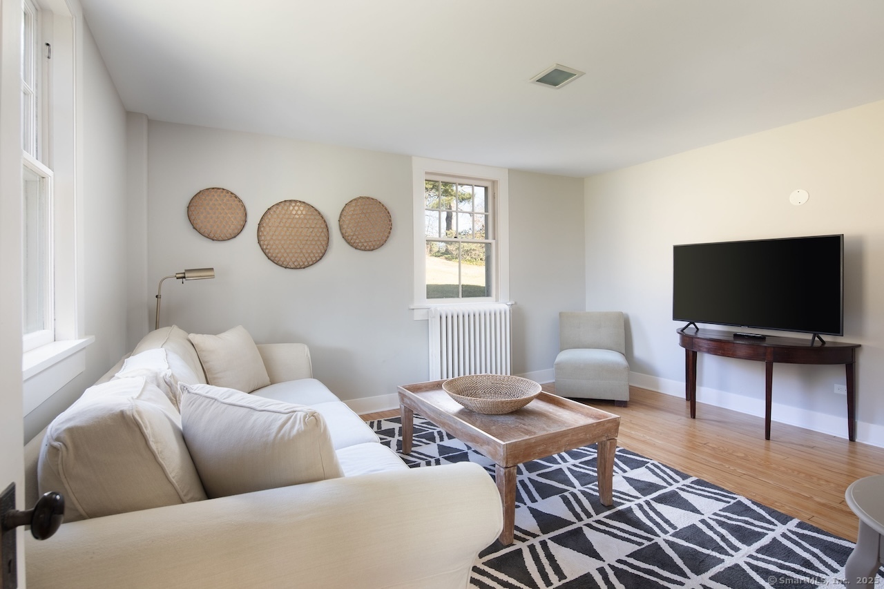 104 Sunset Ridge Road Norfolk, CT 06058 - Photo 9 of 20 a living room with furniture and a flat screen tv