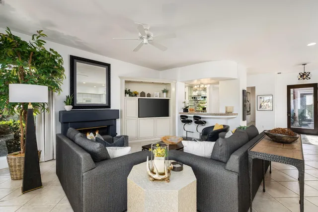 a kitchen with stainless steel appliances kitchen island granite countertop a sink and cabinets